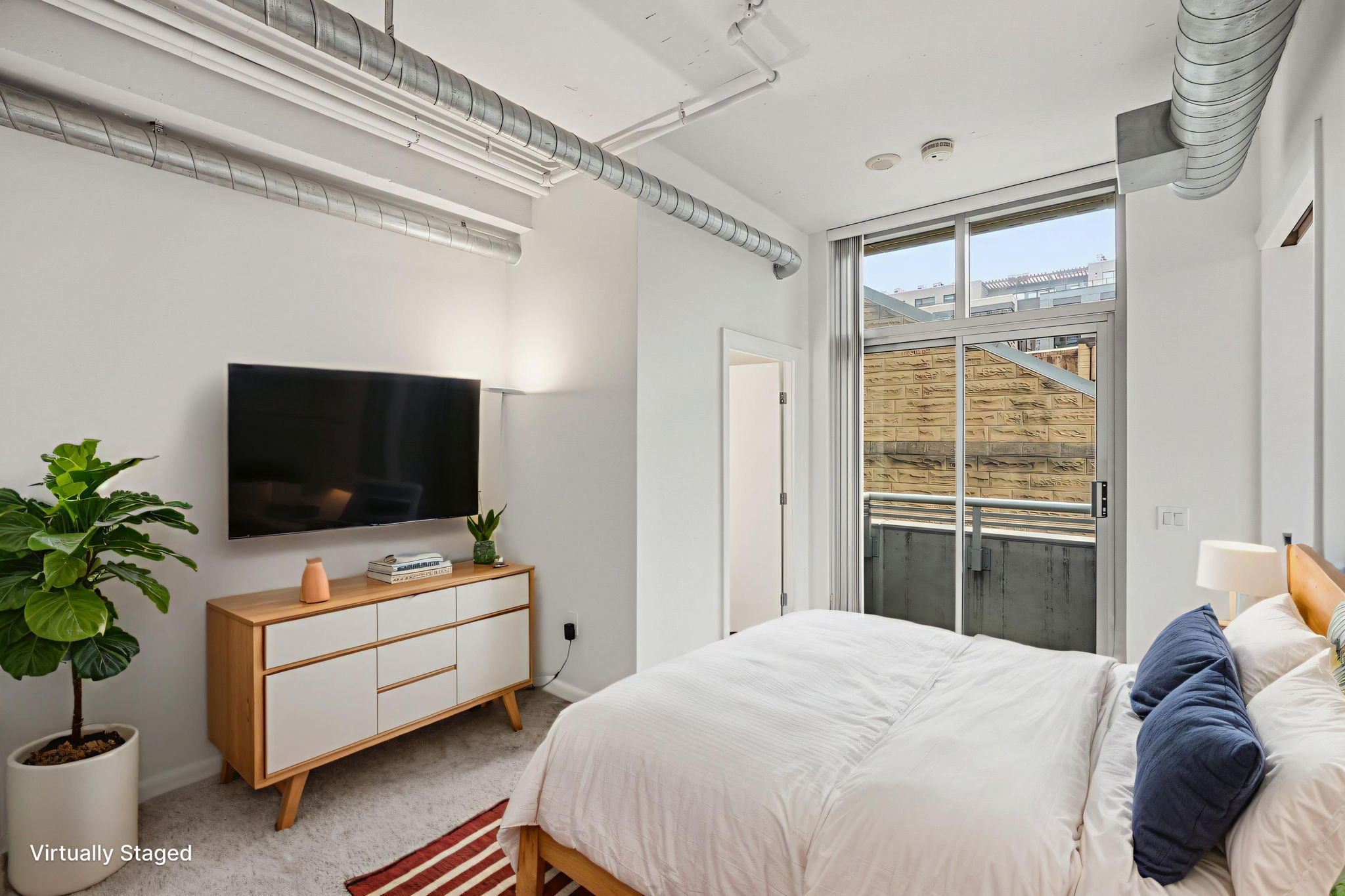 Bedroom 1 w/ Ensuite Bath and Sliding Doors to Balcony