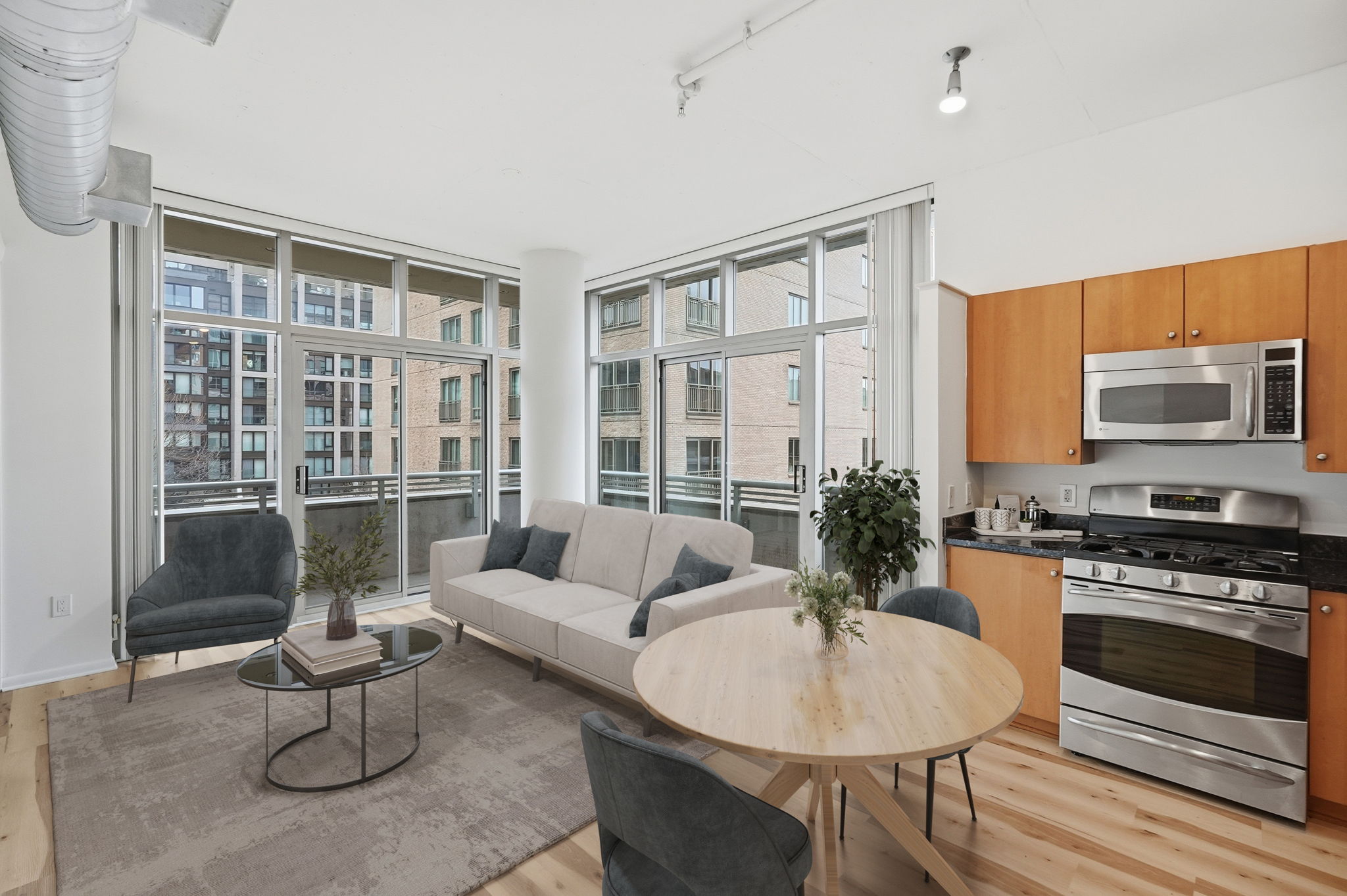 Open Concept Living w/ Sliding Doors to Balcony (Virtually Staged)