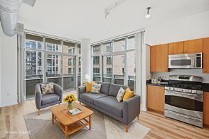 Open Concept Living w/ Sliding Doors to Balcony