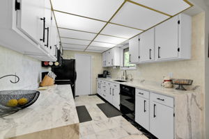 Marble Flooring. Upgraded Cabinet Doors & Drawers