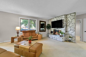 Family Room Area with Gas Fireplace & Mounted TV