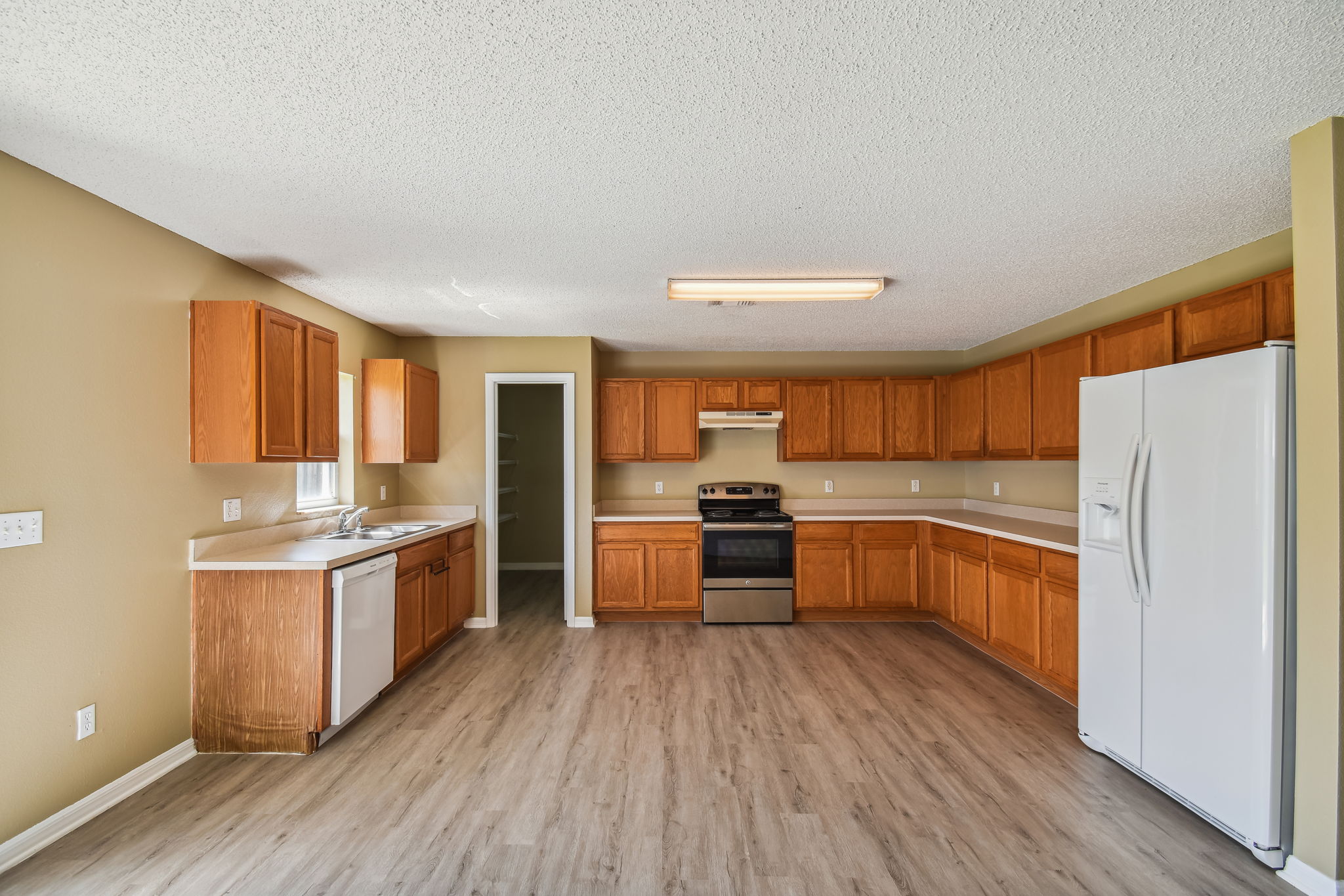 Large eat-in kitchen with luxury vinyl flooring