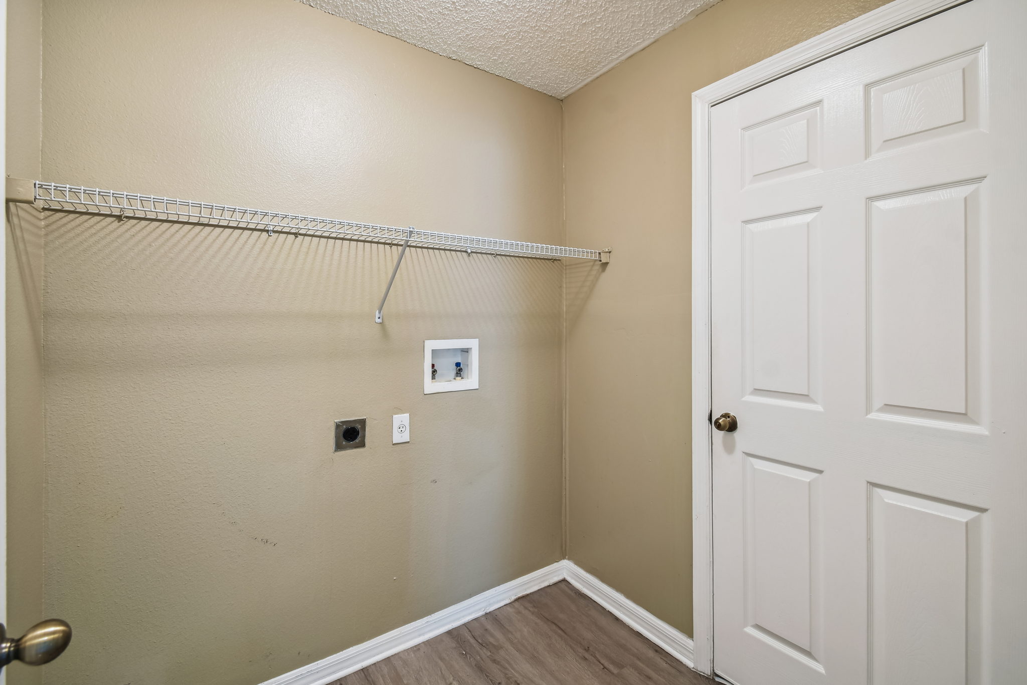 Inside laundry room with LVP flooring