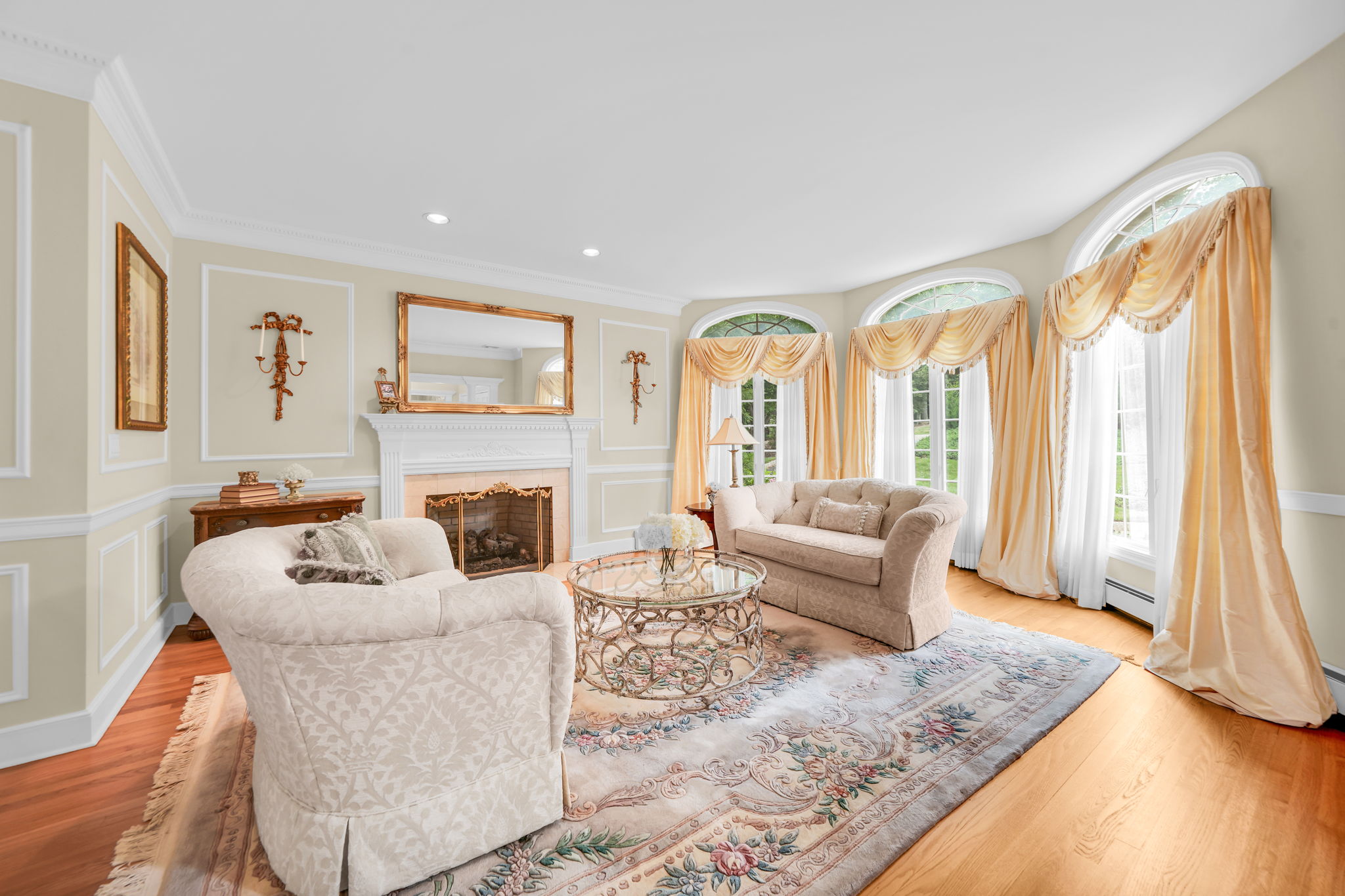 Just off the foyer, a separate living room, warmed by its own fireplace, offers even more space to gather.