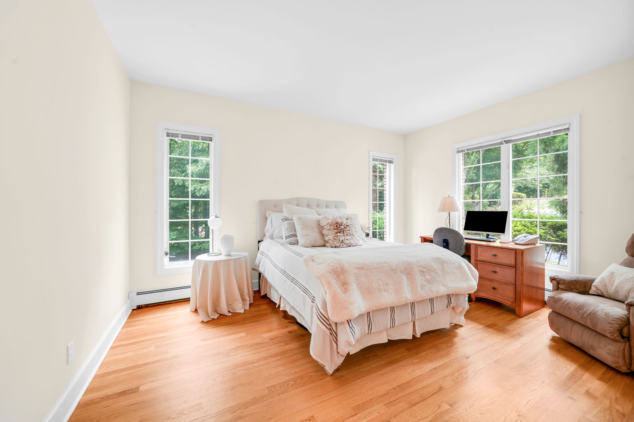 First floor bedroom, complete with its own full en-suite bath, is tucked quietly into the back of the home, offering privacy for guests, au pair, or multigenerational living.