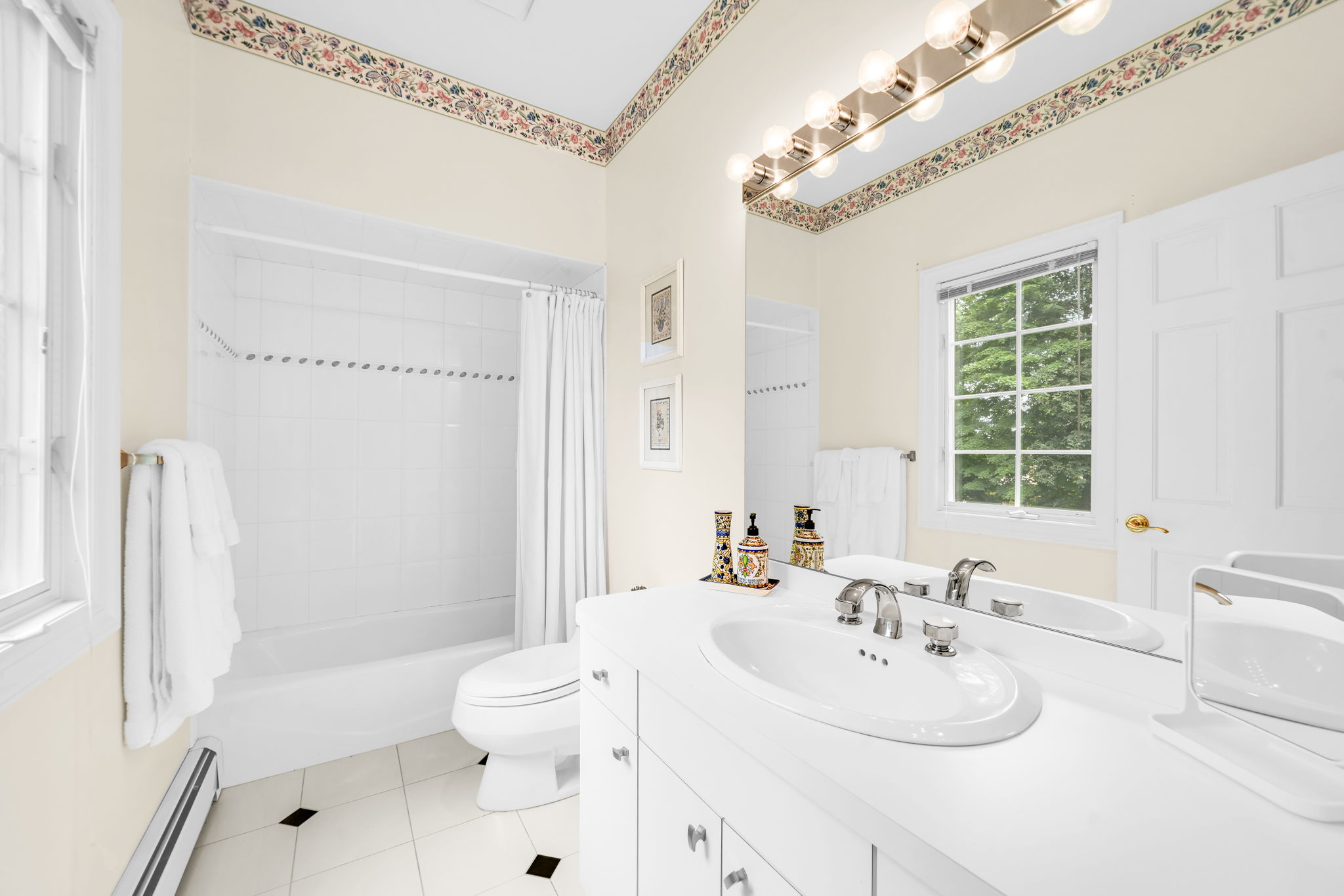 First floor bedroom, complete with its own full en-suite bath, is tucked quietly into the back of the home, offering privacy for guests, au pair, or multigenerational living.