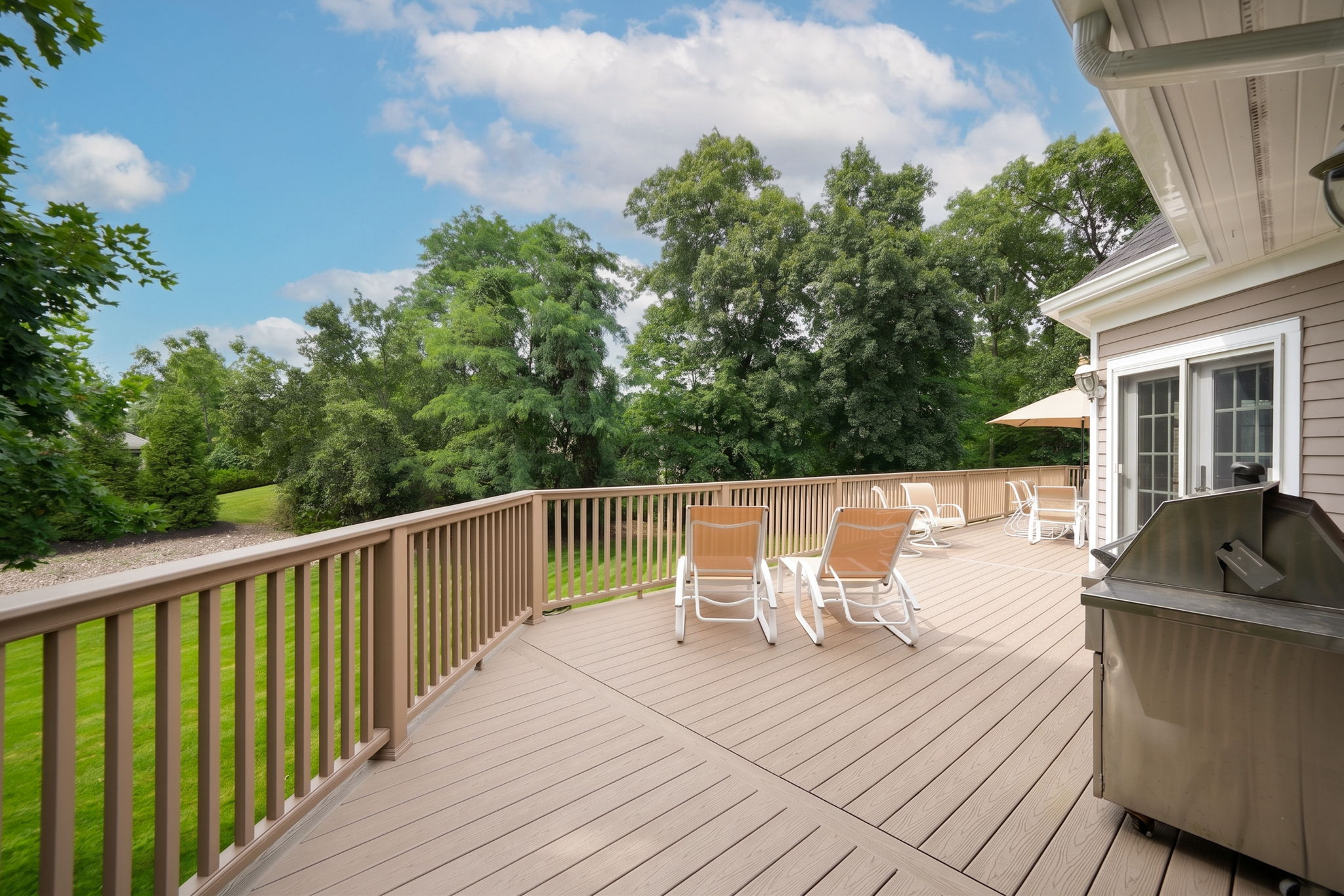 French doors open onto an expansive back deck from kitchen, Great Room and the Laundry Room.