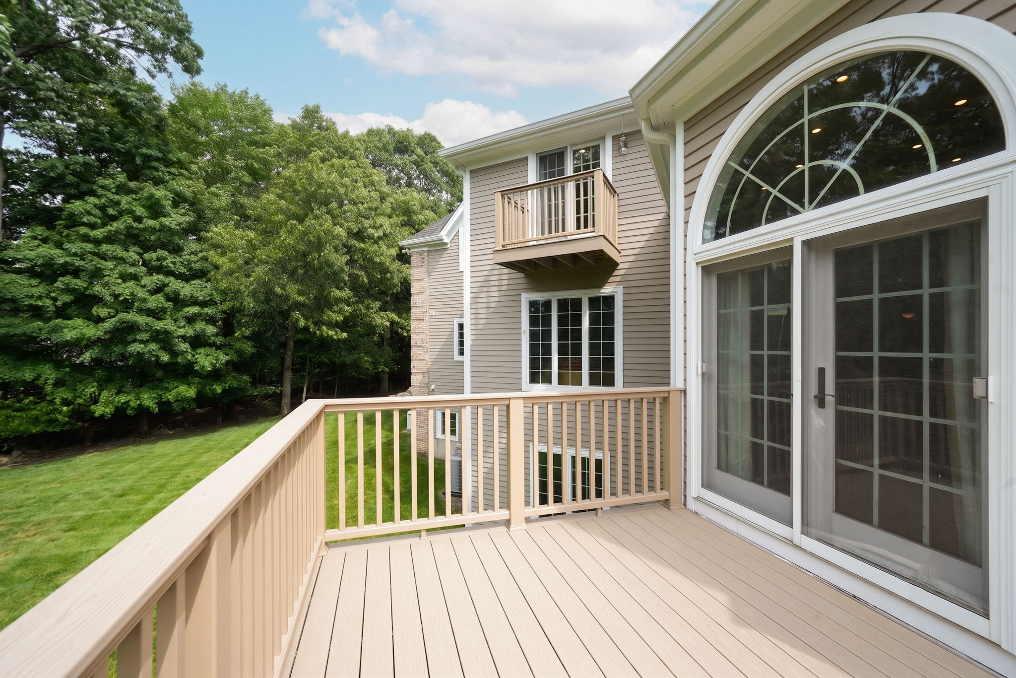 French doors open onto an expansive back deck from kitchen, Great Room and the Laundry Room.