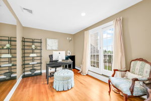 The primary suite, upstairs, is a retreat unto itself: a front bump-out adds architectural interest and extra square footage, while a walk-in closet plus a second closet handle wardrobe needs with ease. Its spa-style en-suite bath features in-floor heat, a walk-in shower, soaking tub, and bidet, along with its own fireplace, and a private sitting room or office with a balcony overlooks the sprawling backyard below.