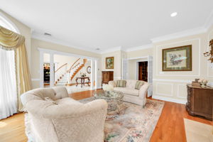 Just off the foyer, a separate living room, warmed by its own fireplace, offers even more space to gather.