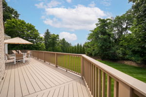 French doors open onto an expansive back deck from kitchen, Great Room and the Laundry Room.