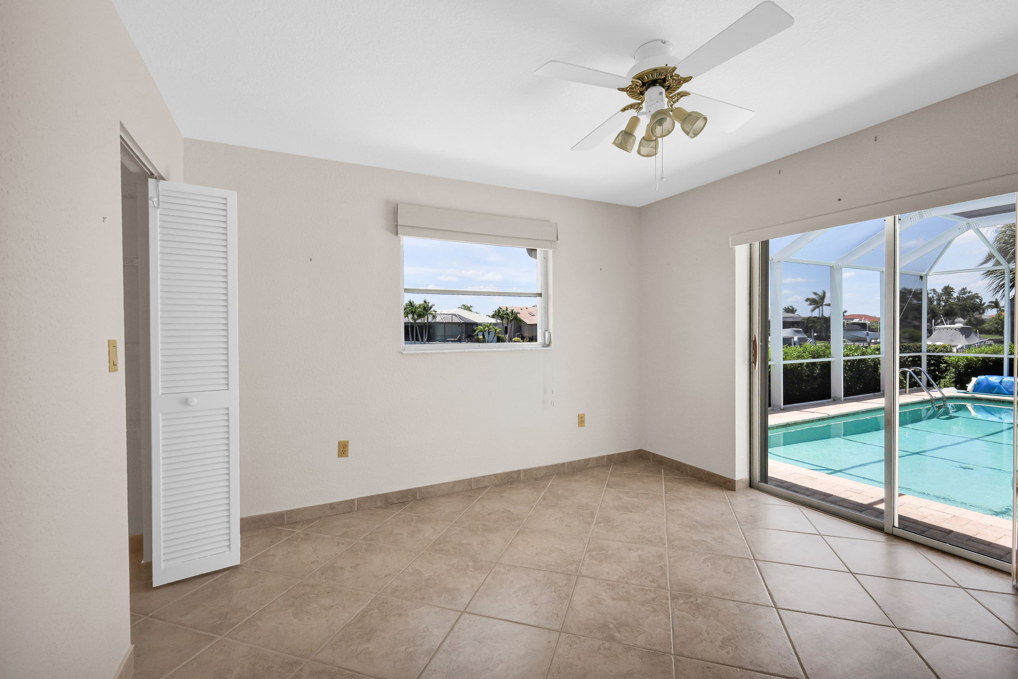 Bedroom 3 with slider to pool & large walk-in