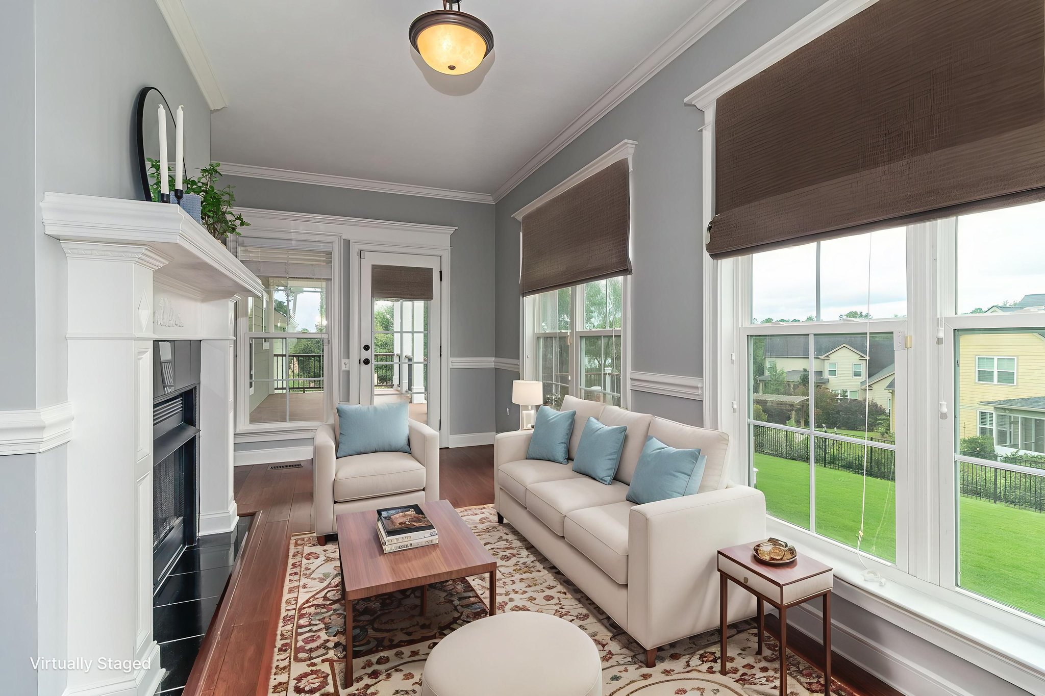 Sun Room W/Fireplace virtually staged.jpeg