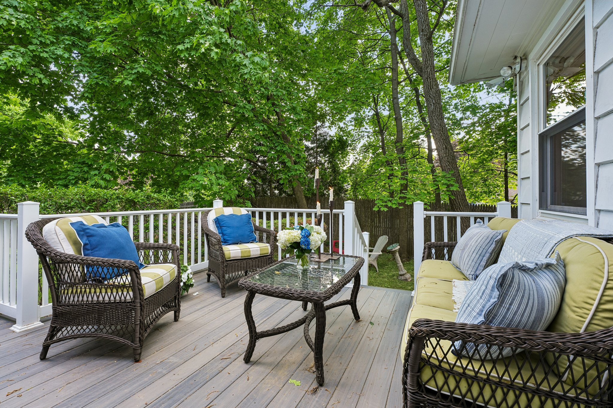 This expansive deck was made for gathering, lingering, and soaking in the kind of peaceful outdoor living that feels worlds away from the city.