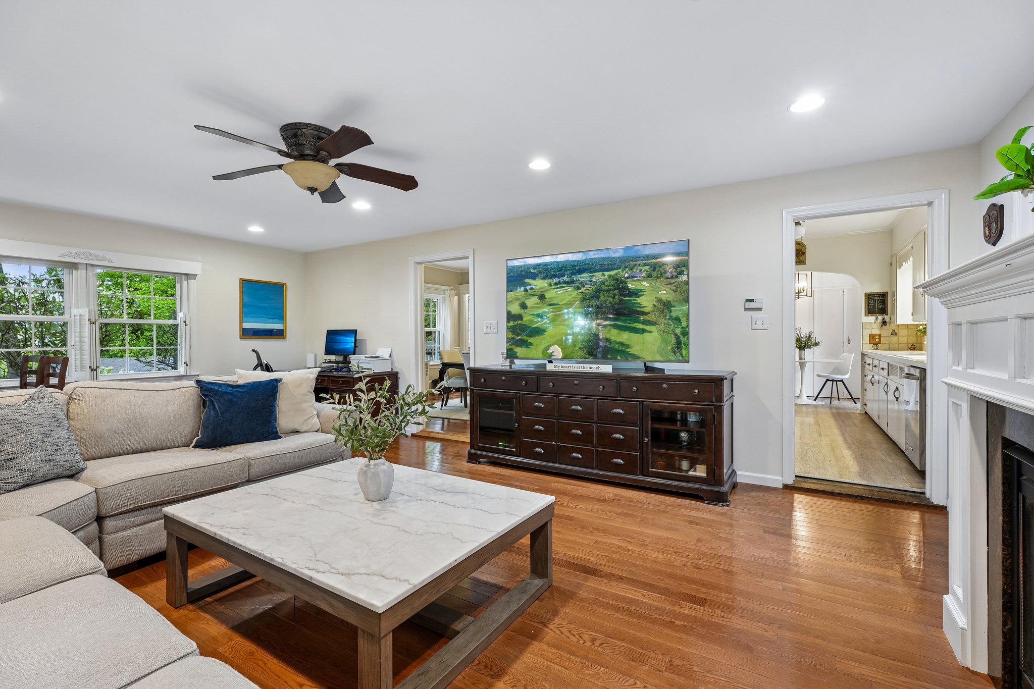 The gathering space every great family home deserves - perfectly positioned beside the kitchen and dining room for Sunday dinners, Super Bowls, Olympic watch parties, birthday cakes, homework sessions, and Saturday morning cartoons by the fire.