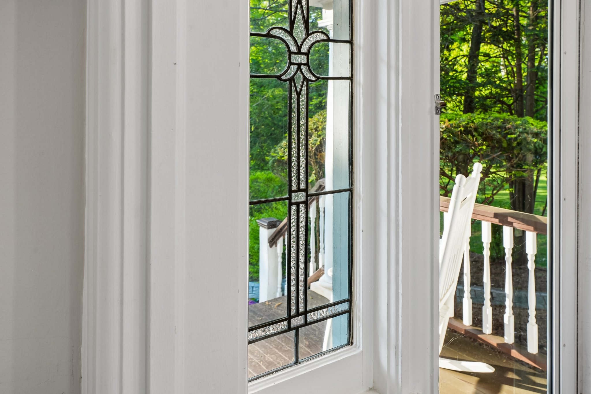 The leaded glass surrounding this front entry is pure old-house magic.