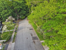 An end-of-cul-de-sac setting wrapped in woods offers the best kind of neighborhood living - quieter street, no traffic, extra privacy, and that wonderful feeling that the world slows down a little when you arrive home.