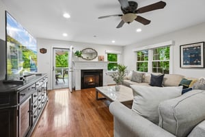 The center of it all. With windows on three sides, a gas fireplace, and easy connection to the kitchen and deck, this fabulous family room brings warmth, sunlight, and easy farmhouse-style living to the heart of the home.