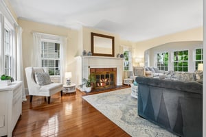 The living room is bright, gracious, and centered around a classic fireplace, it feels like the heart of generations of holidays, storytelling, and evenings that linger long after dinner.