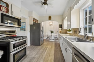 With peaceful backyard views, wonderful natural light, and easy connection to the family room and deck, this space is ready for its next chapter of memory-making, recipes, traditions, and laughter-filled evenings at home.
