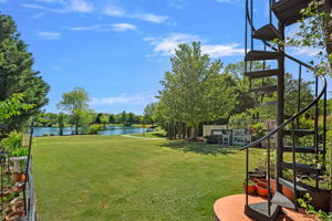 Spiral Staircase from Balcony to Covered Patio/Pond View