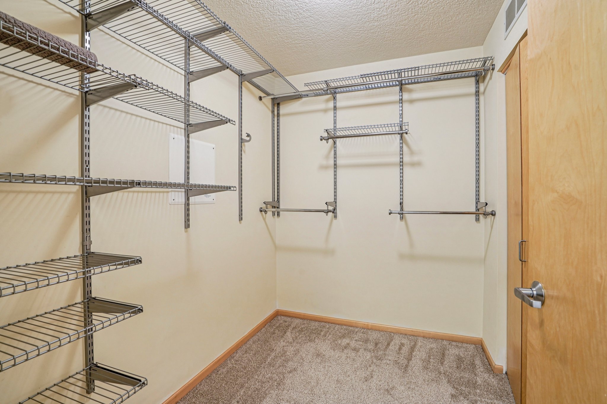Walk-in closet includes organizers