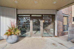 Formal entrance to mailroom & lobby of a well-maintained building