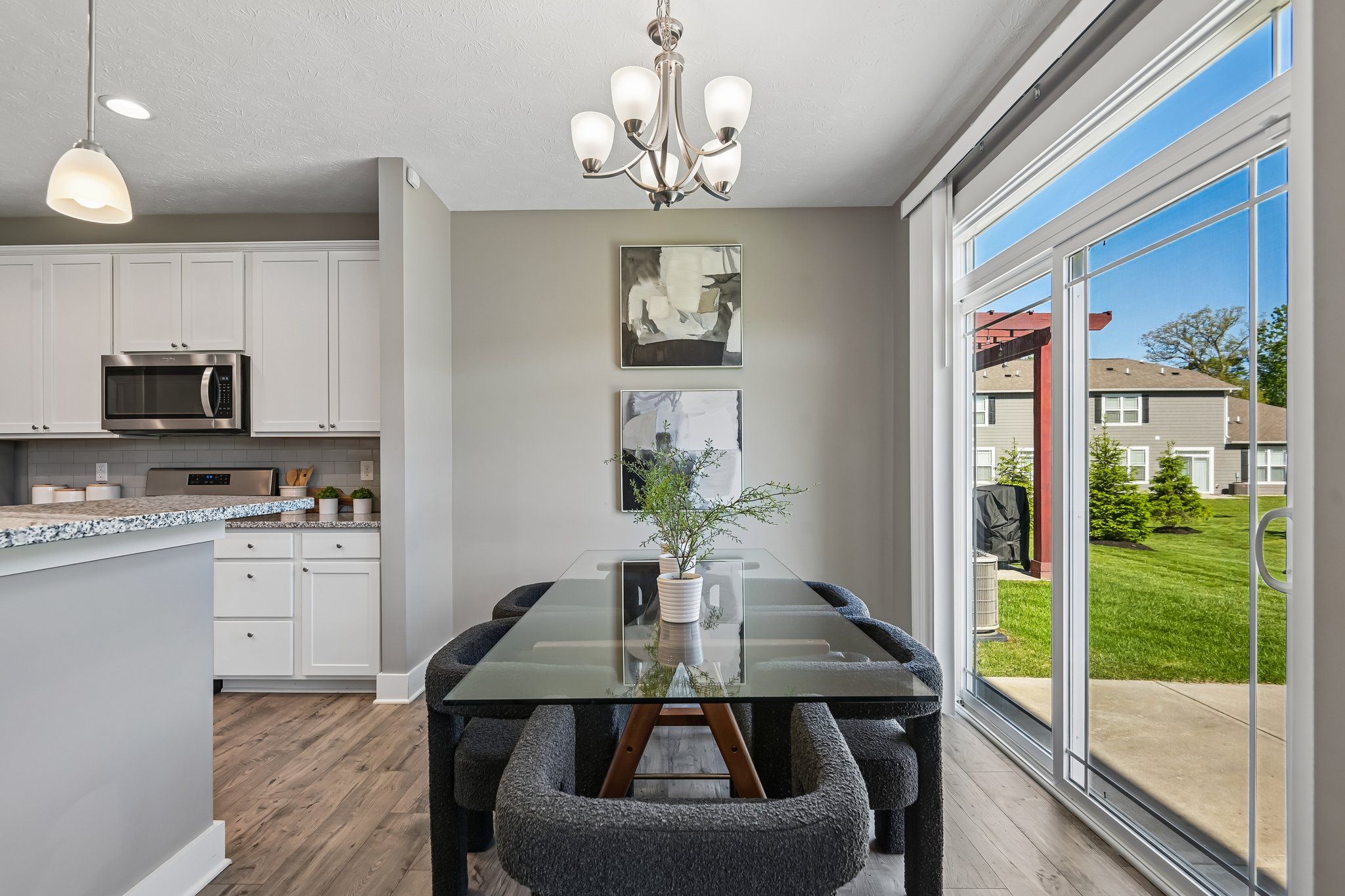 Dining space overlooks the backyard and offers easy access to outdoor entertaining