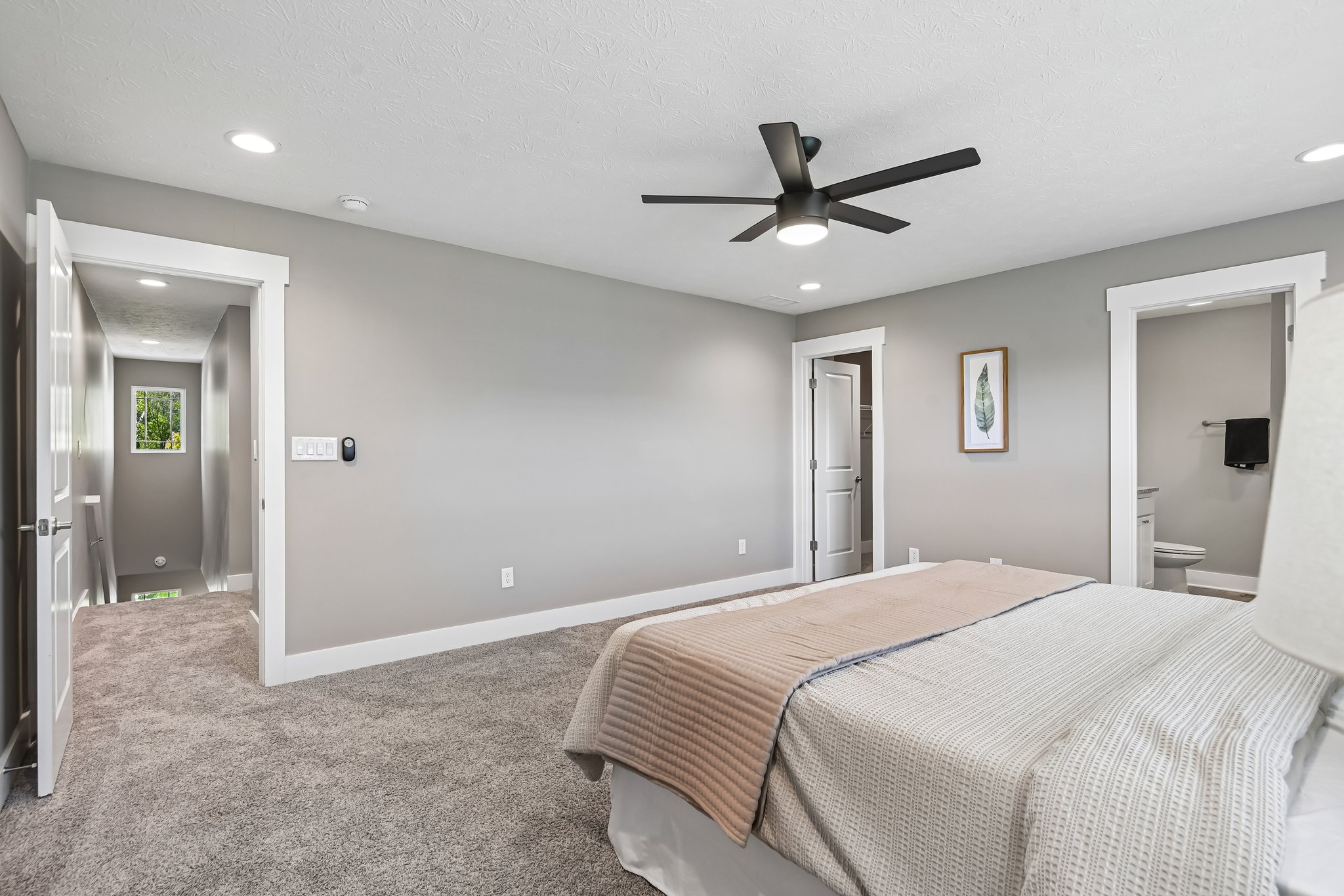 Thoughtfully designed primary suite with easy access to bath and walk-in closet.