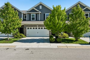 Modern curb appeal meets low-maintenance living in this beautifully designed Fishers home.