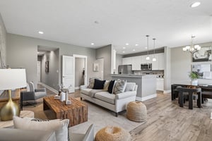 Open sightlines seamlessly connect the living room, dining area, and kitchen..