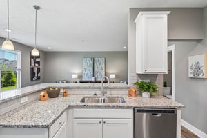 Kitchen sink overlooks the living area, creating a connected and open feel.