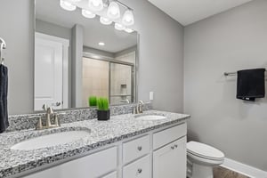 Double vanity provides convenience and extra storage for busy mornings.
