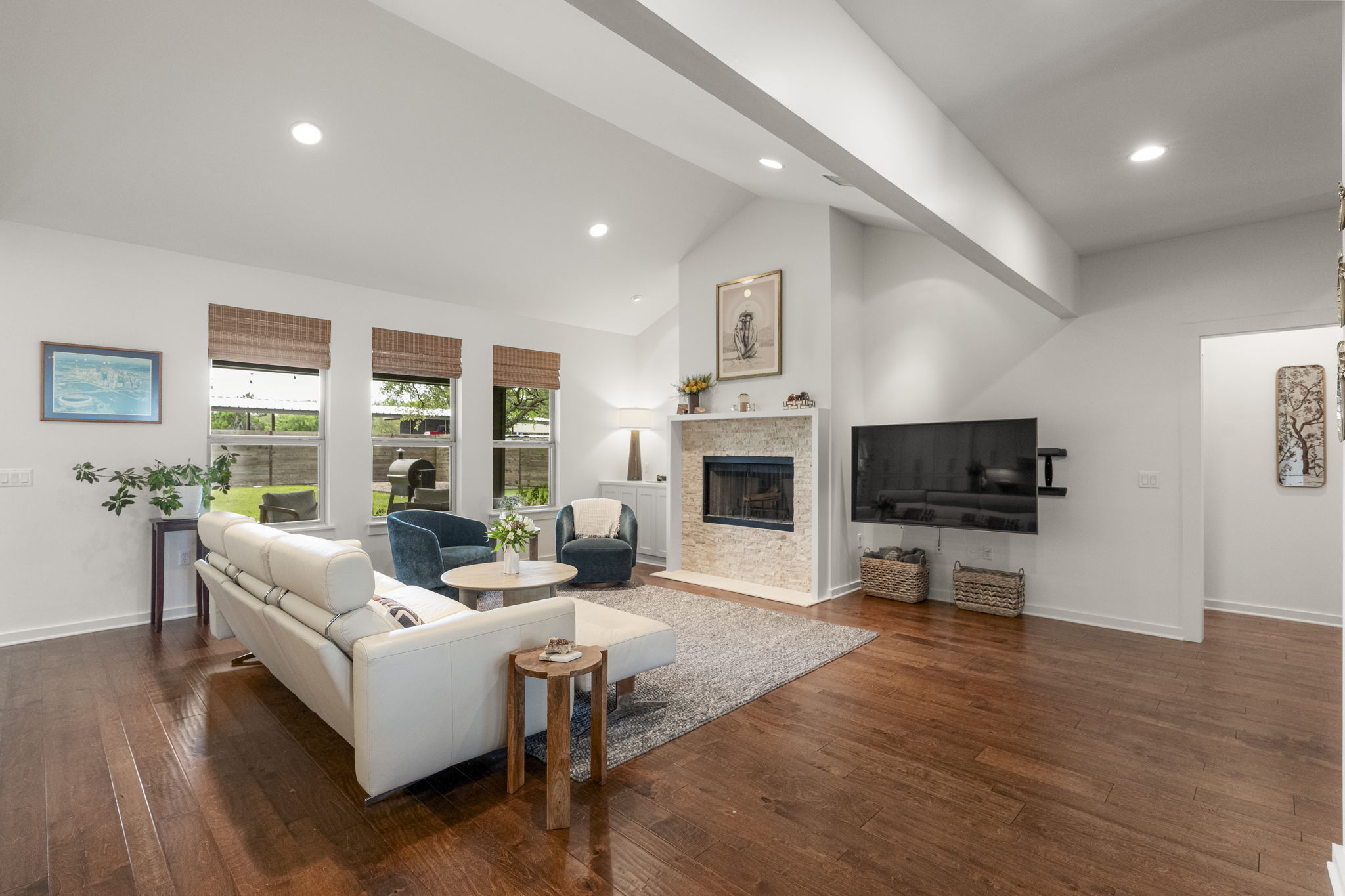 Rich hardwood floors flow throughout the main living areas, adding warmth and timeless appeal to the living room.