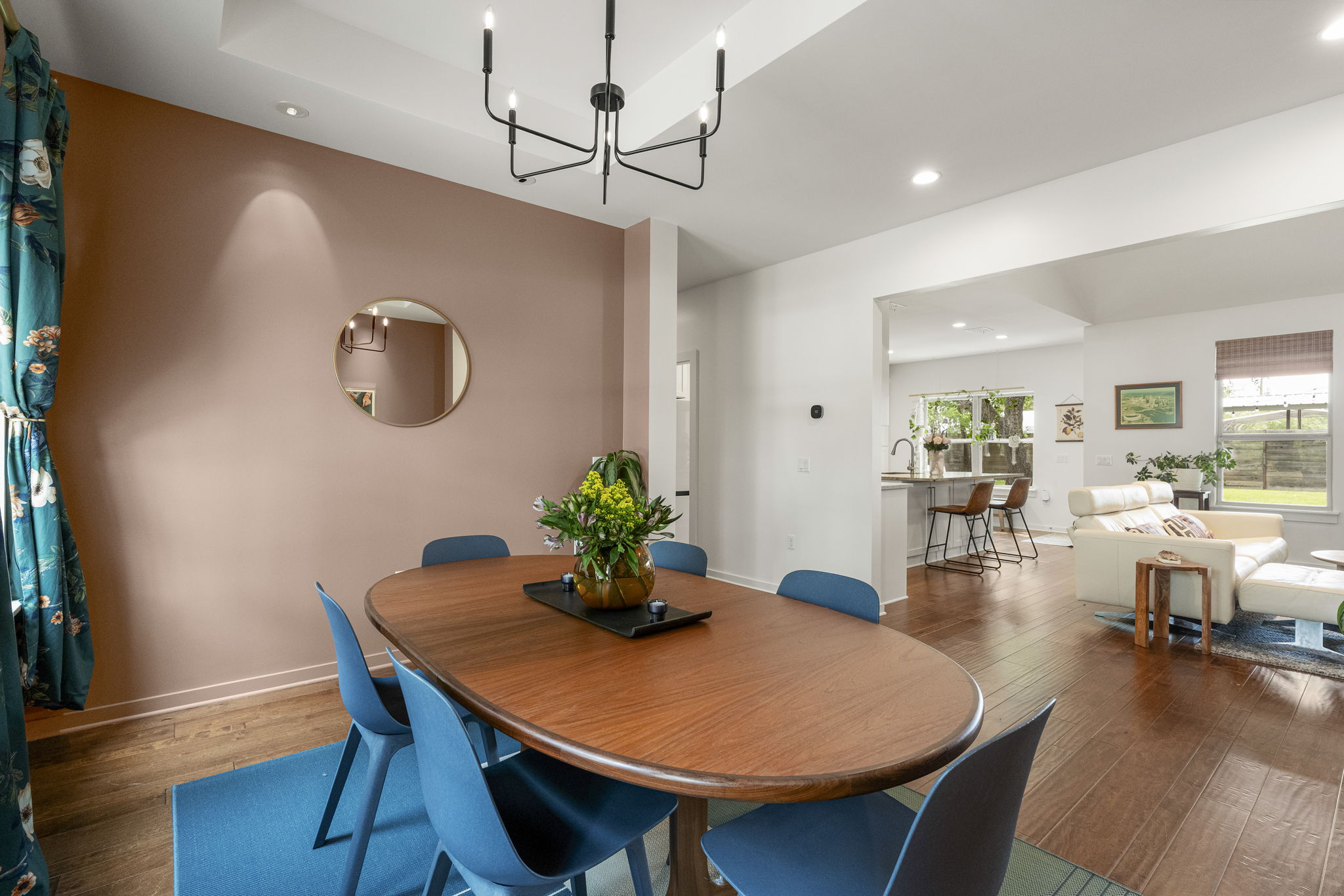 Open to the main living areas while offering a defined space for gathering around the table.