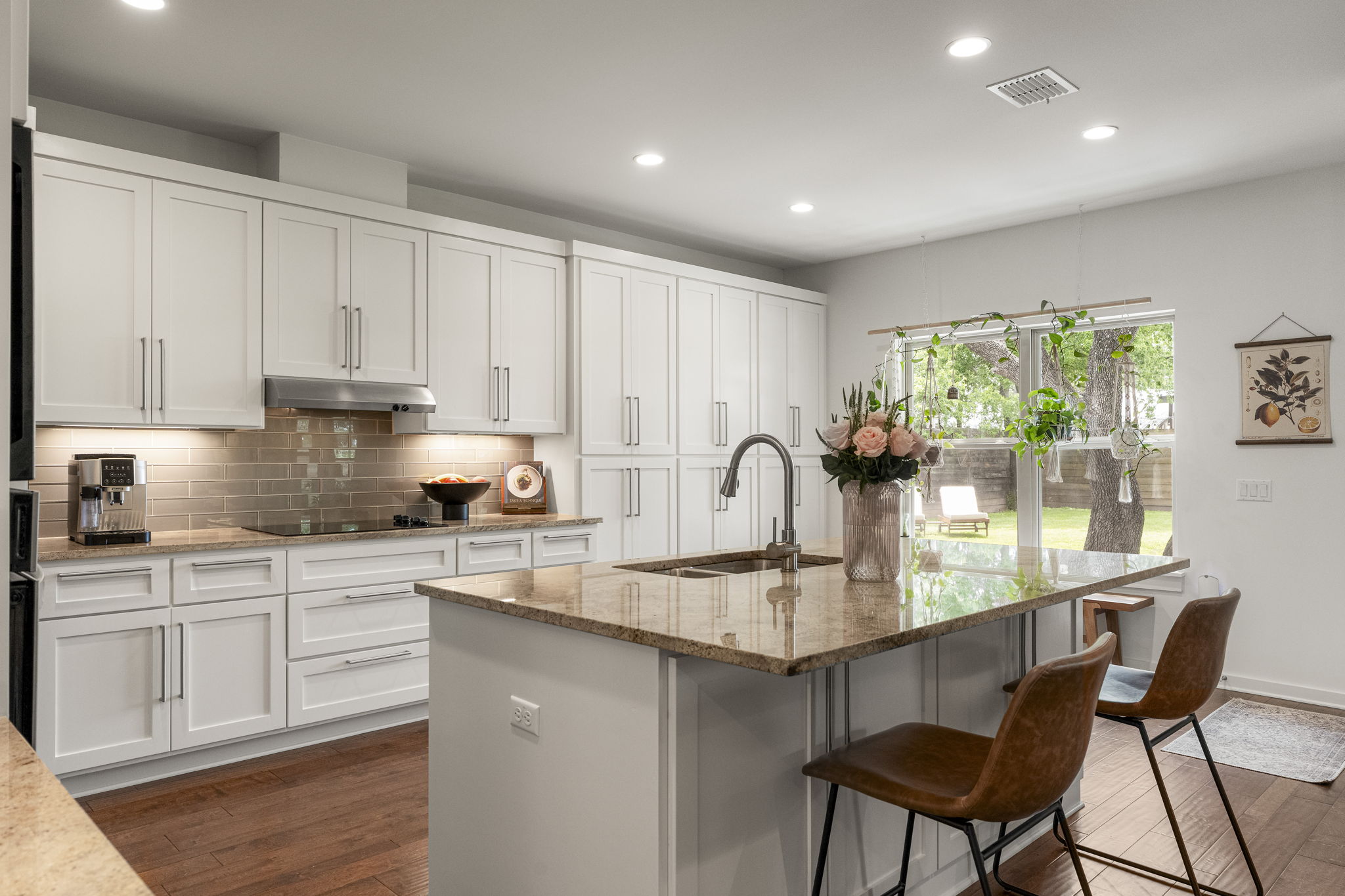 The oversized center island naturally becomes the heart of the kitchen, bringing meal prep, conversation, and entertaining together.