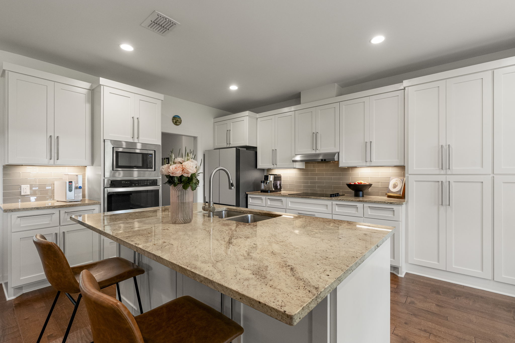 Clean lines, warm finishes, and a thoughtful layout create a kitchen that's both inviting and functional.