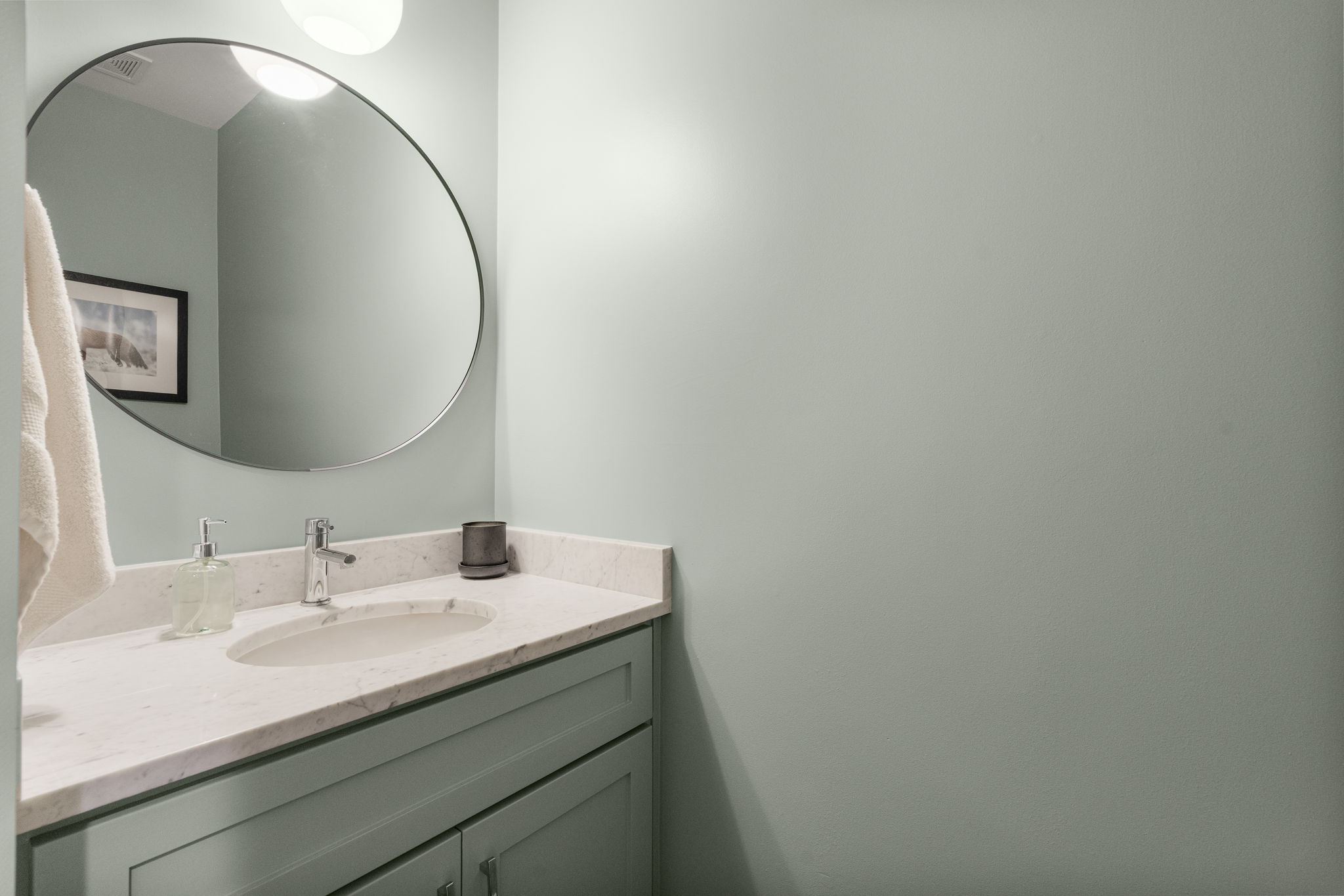Half bath on the hallway with the laundry room