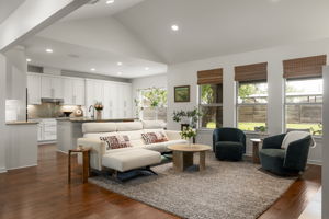 Vaulted ceilings, abundant natural light, and an open layout create a bright, welcoming space for everyday living.