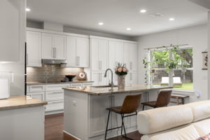 Whether preparing weeknight meals or entertaining guests, the open kitchen offers plenty of workspace and easy flow to the living areas.
