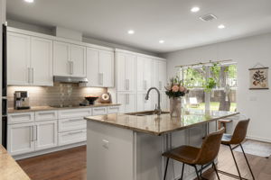 The oversized center island naturally becomes the heart of the kitchen, bringing meal prep, conversation, and entertaining together.