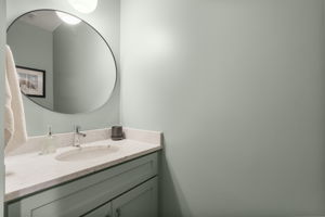 Half bath on the hallway with the laundry room