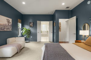 Privately situated on its own wing of the home, the primary suite offers a spacious spa-like bath and dual walk-in closets.