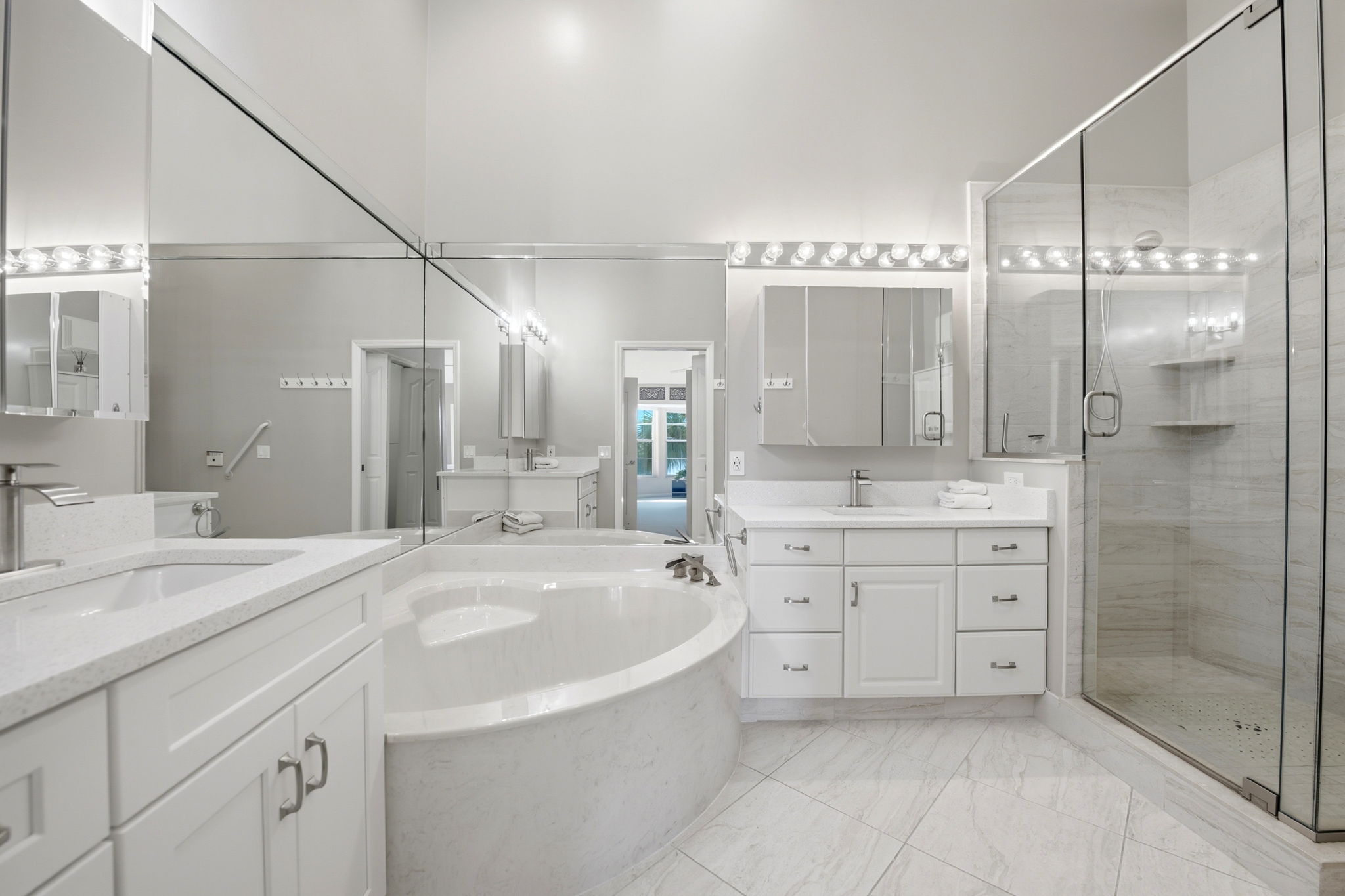 Primary Bathroom with quartz vanities