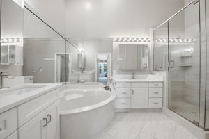 Primary Bathroom with quartz vanities