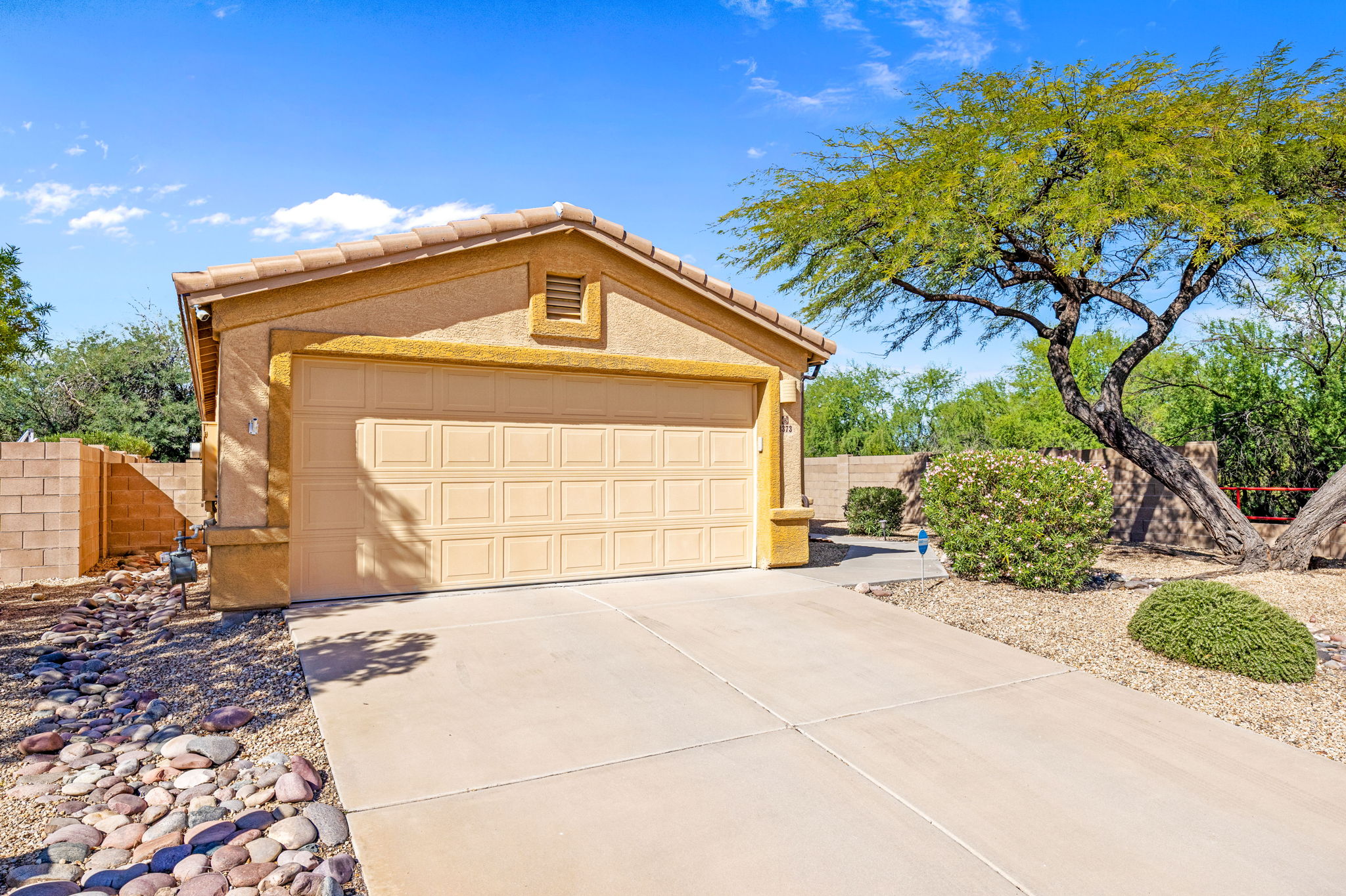 Two-car front entry garage with concrete driveway