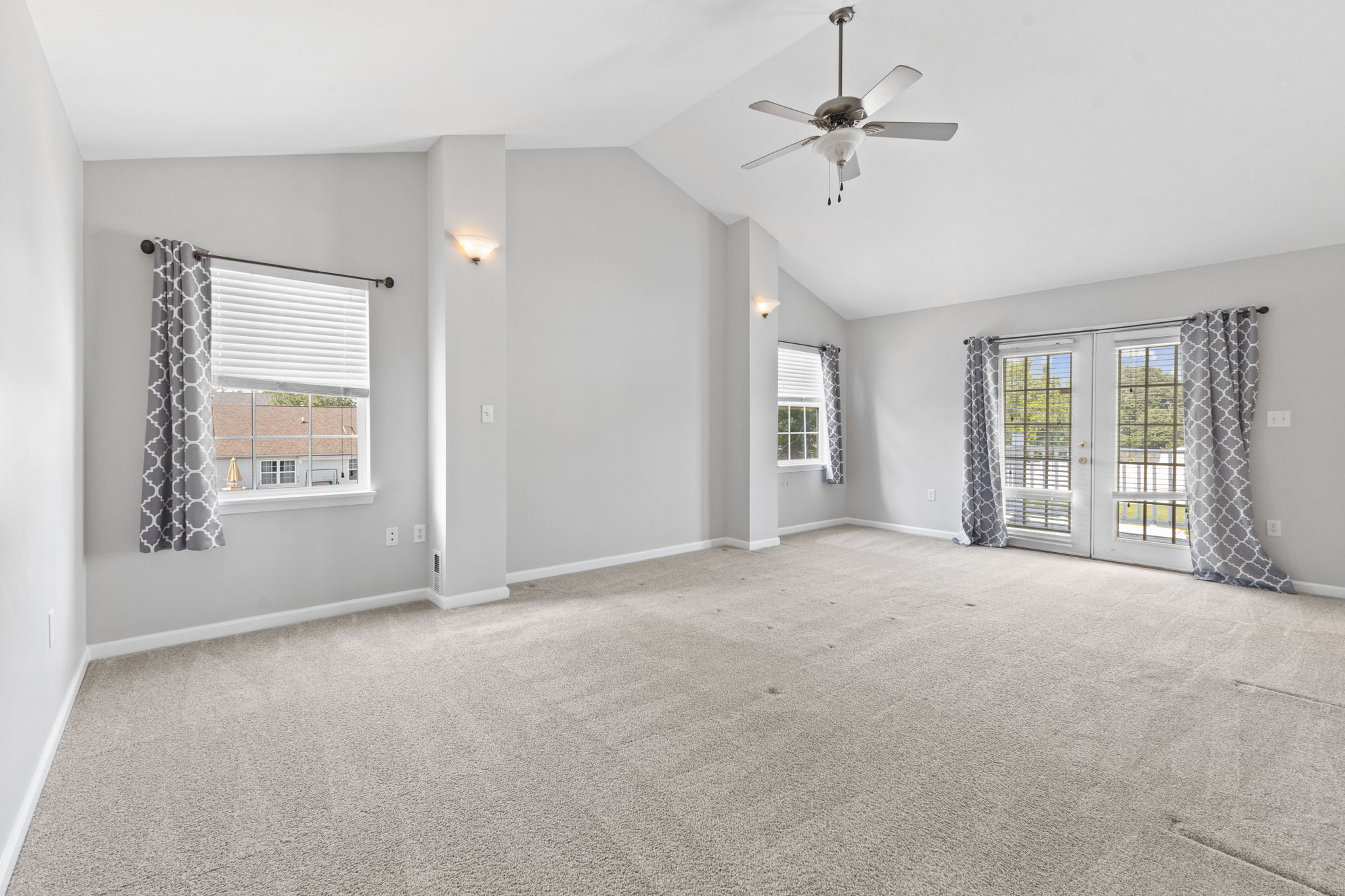 Primary bedroom with balcony access
