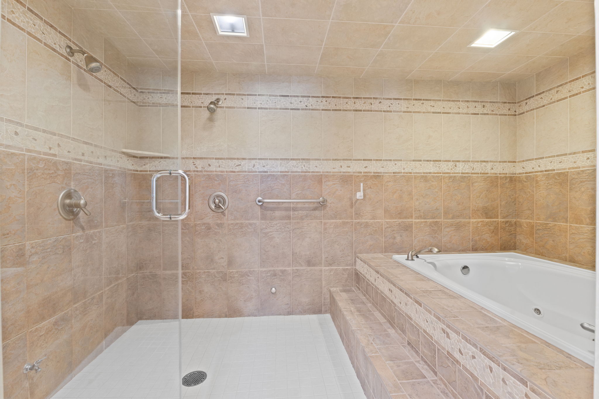 Dual shower, jetted tub, steam room combo
