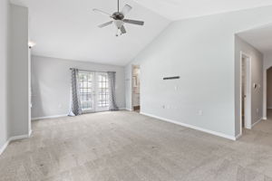 Primary bedroom with balcony access