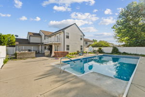 Heated pool with automatic cover